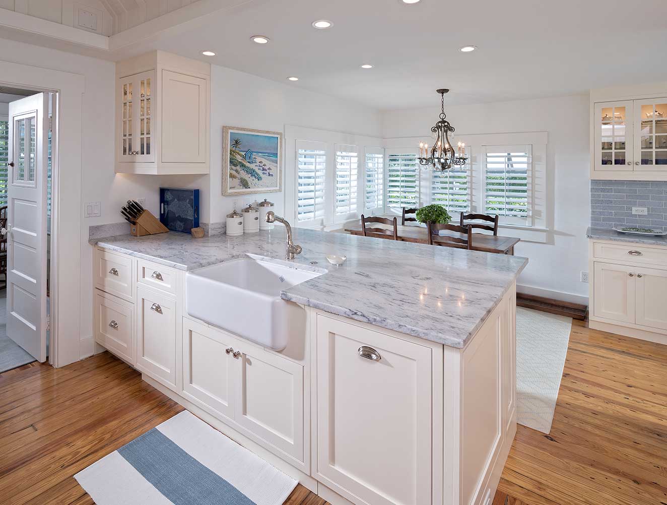 Coastal kitchen with breakfast nook and farmhouse style sink