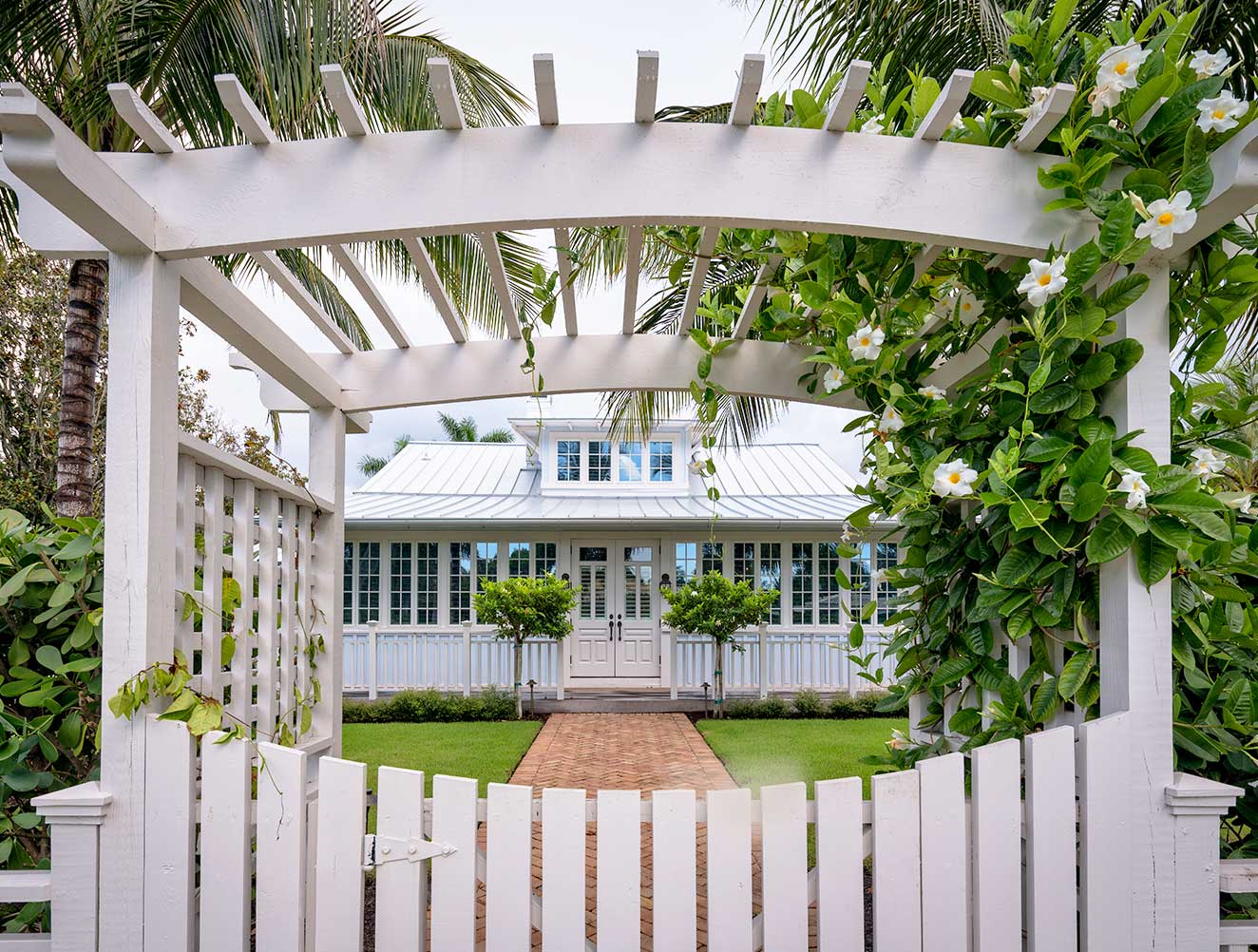 Garden entrance of Key West style home in Naples, Florida.