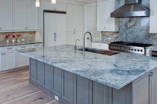 Luxury kitchen remodel with custom cabinetry, granite counter tops and granite backsplash