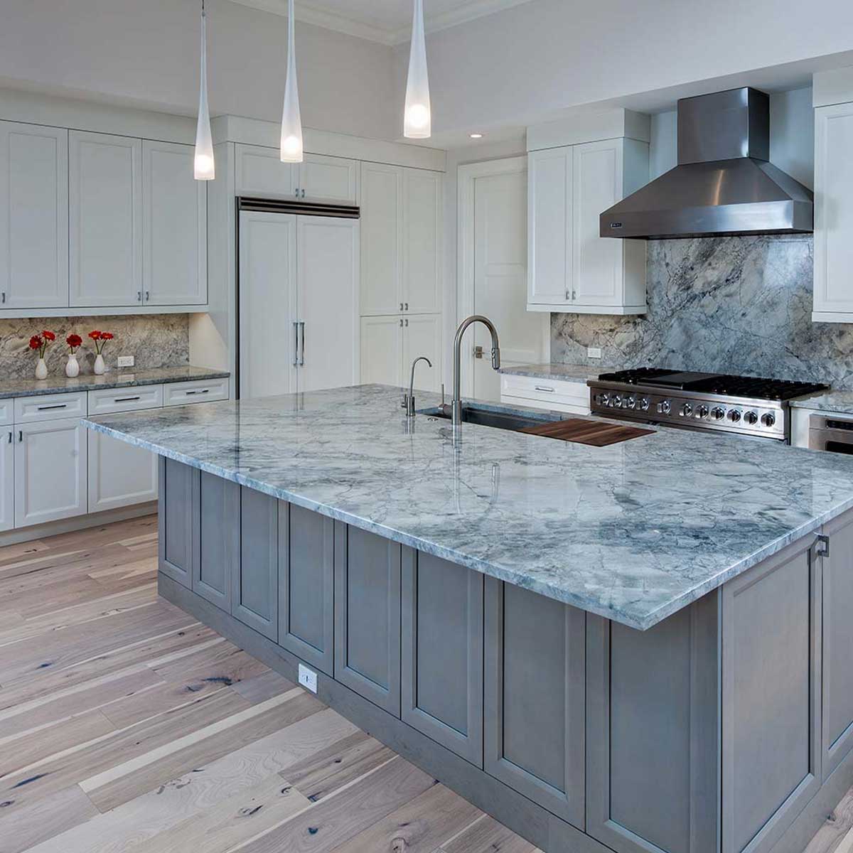 Luxury kitchen remodel with custom cabinetry, granite counter tops and granite backsplash